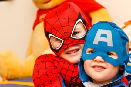 kids in spiderman and Captain America costumes